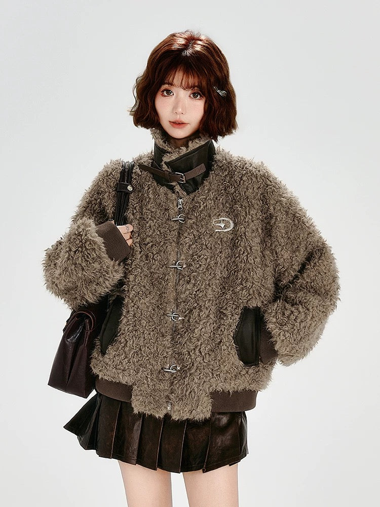 Person wearing a brown textured jacket with a white background