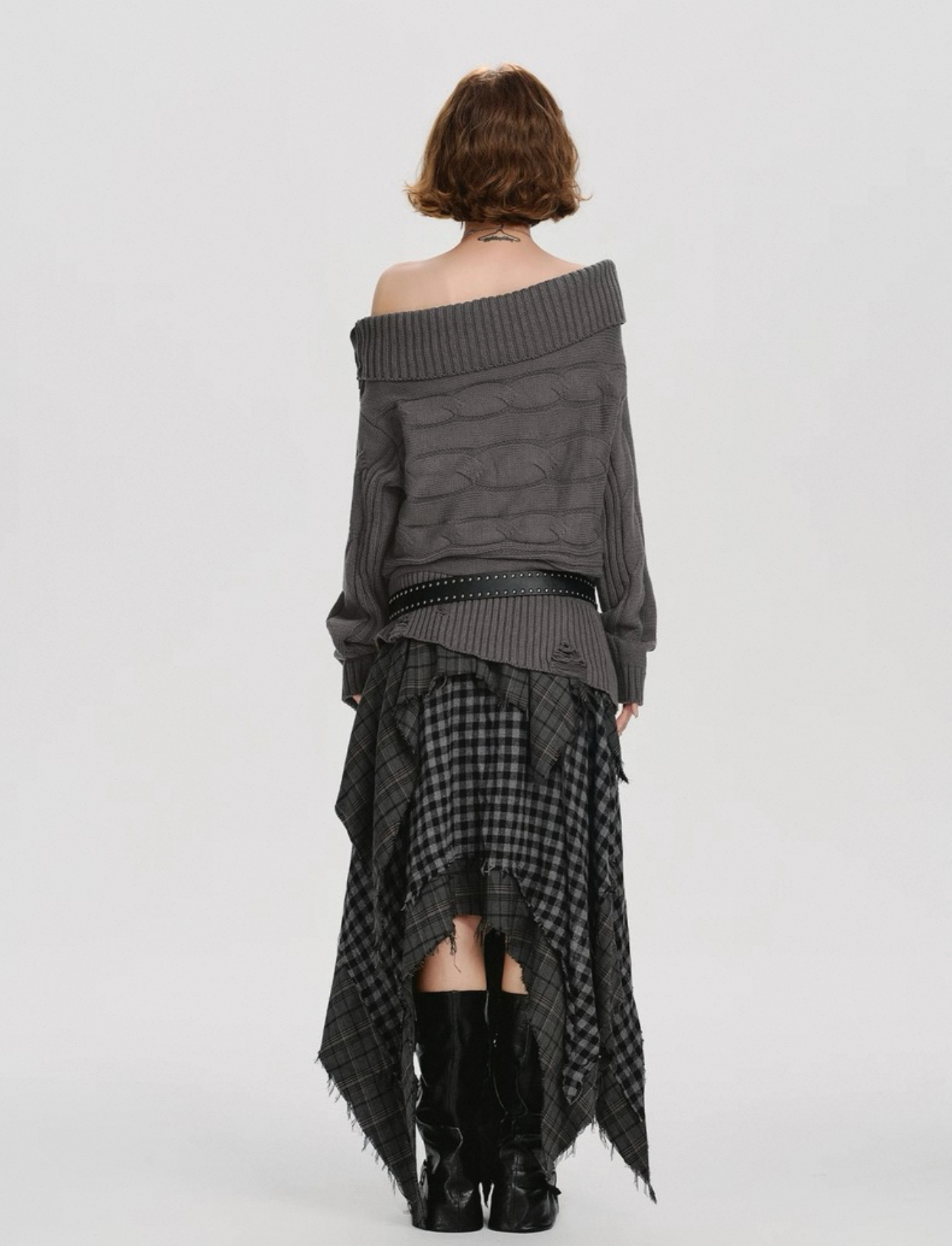 Woman wearing a gray off-shoulder top and plaid skirt on a white background, with 'GIRLYHALO' branding.